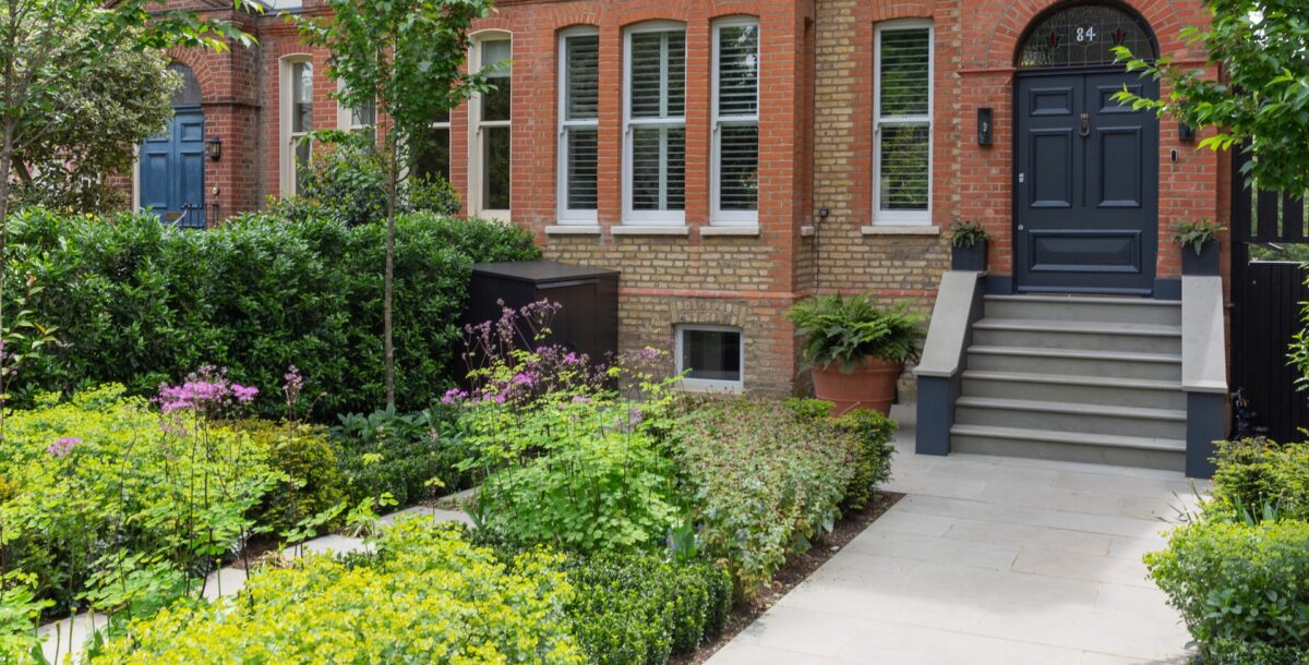 Front garden by Belderbos landscapes with wild flower planting and wide path