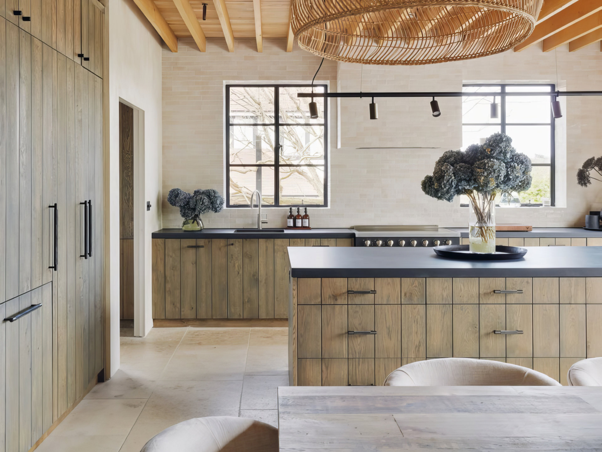 Delve Architects retrofitted and extended a 220sqm, four-bedroom house in Winchmore Hill, north London, improving the insulation and installing new glazing to bring in more light. The kitchen floor tiles are limestone. The project cost £650,000.