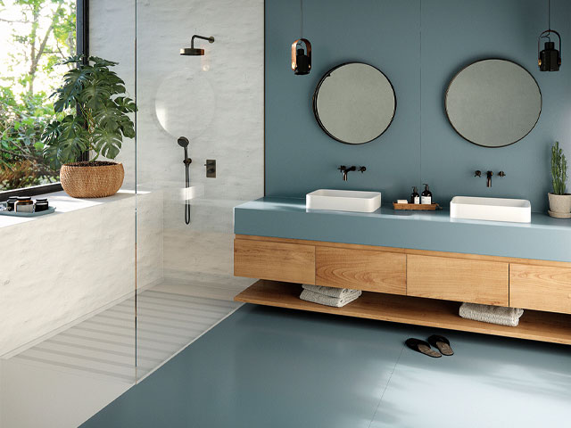 Bathroom floor ideas double sink unit and double circle mirrors large marble walk in shower black fixtures and fittings