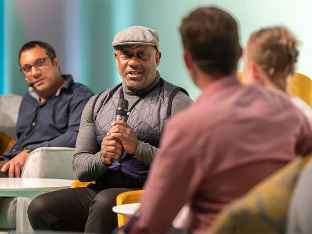 Kunle Barker on stage at Grand Designs Live