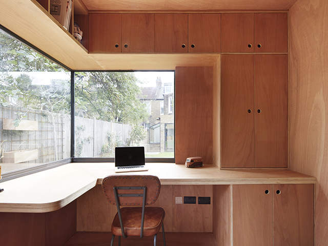 Garden office interior with bespoke wooden desk and fittings by RISE Design Studio