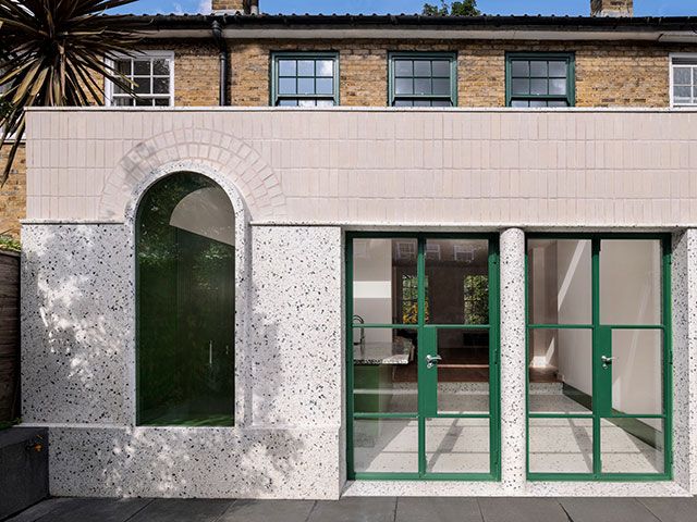 creative extension with terrazzo walls and green aluminium doors - grand designs