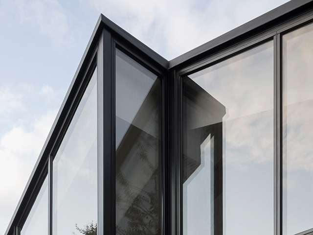 exterior roof with bay window of modern extension - grand designs